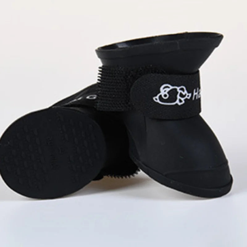 Black waterproof, non-slip dog rain boots with adjustable straps for paw protection and outdoor comfort.