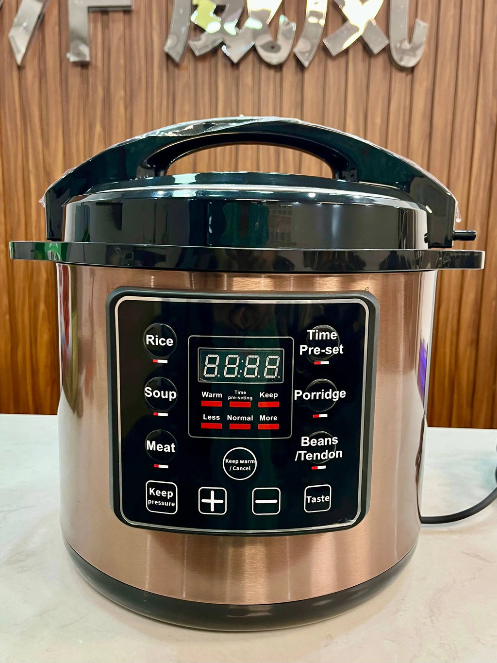 Stainless electric pressure cooker with digital presets panel and Time Pre-set display