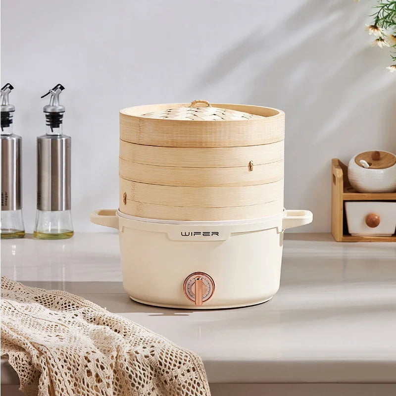 Beige electric bamboo steamer hot pot with stacked bamboo baskets and front power knob