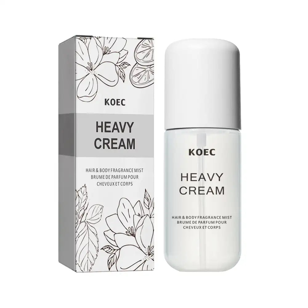 KOEC Heavy Cream hair and body fragrance mist in a clear cylinder bottle with white cap and matching floral box.