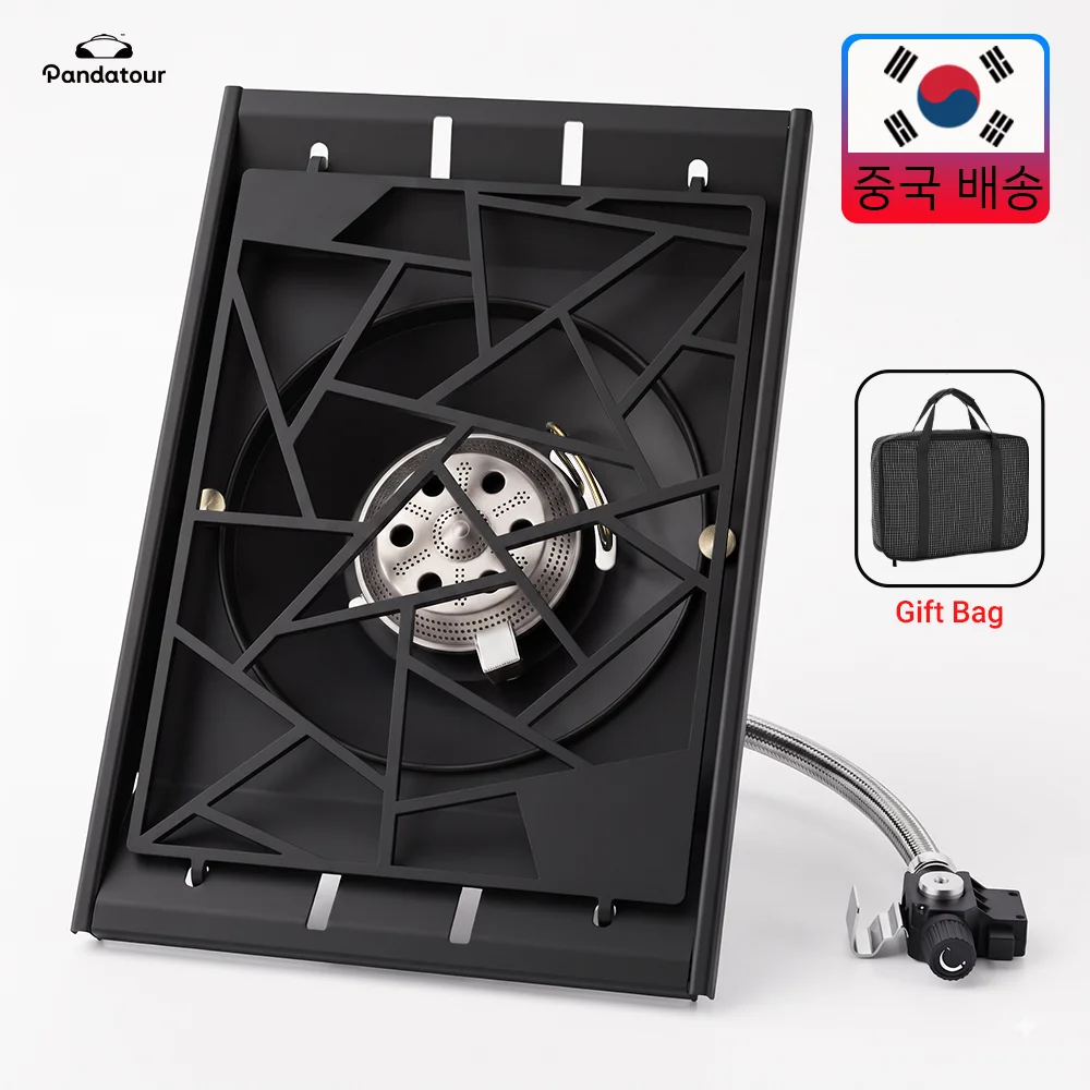 Portable tabletop camping stove with black burner grate, hose, and compact frame