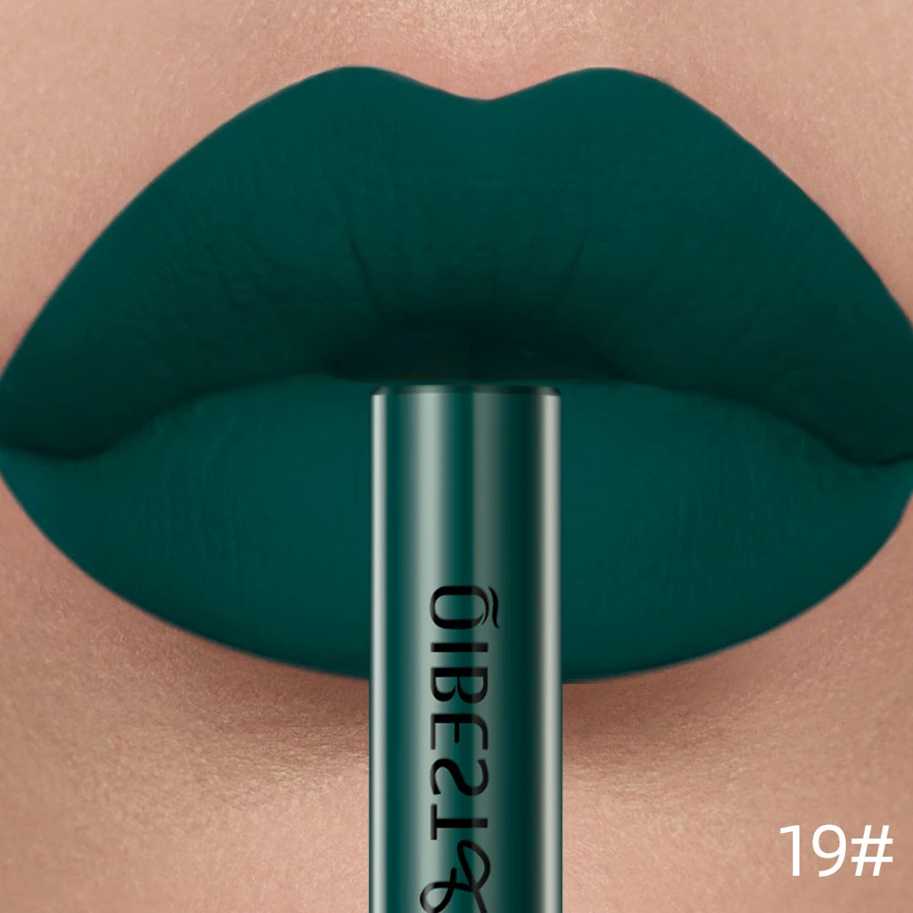 Long-lasting matte liquid lipstick in dark green velvet finish with matching tube packaging, nonstick lip stain formula.