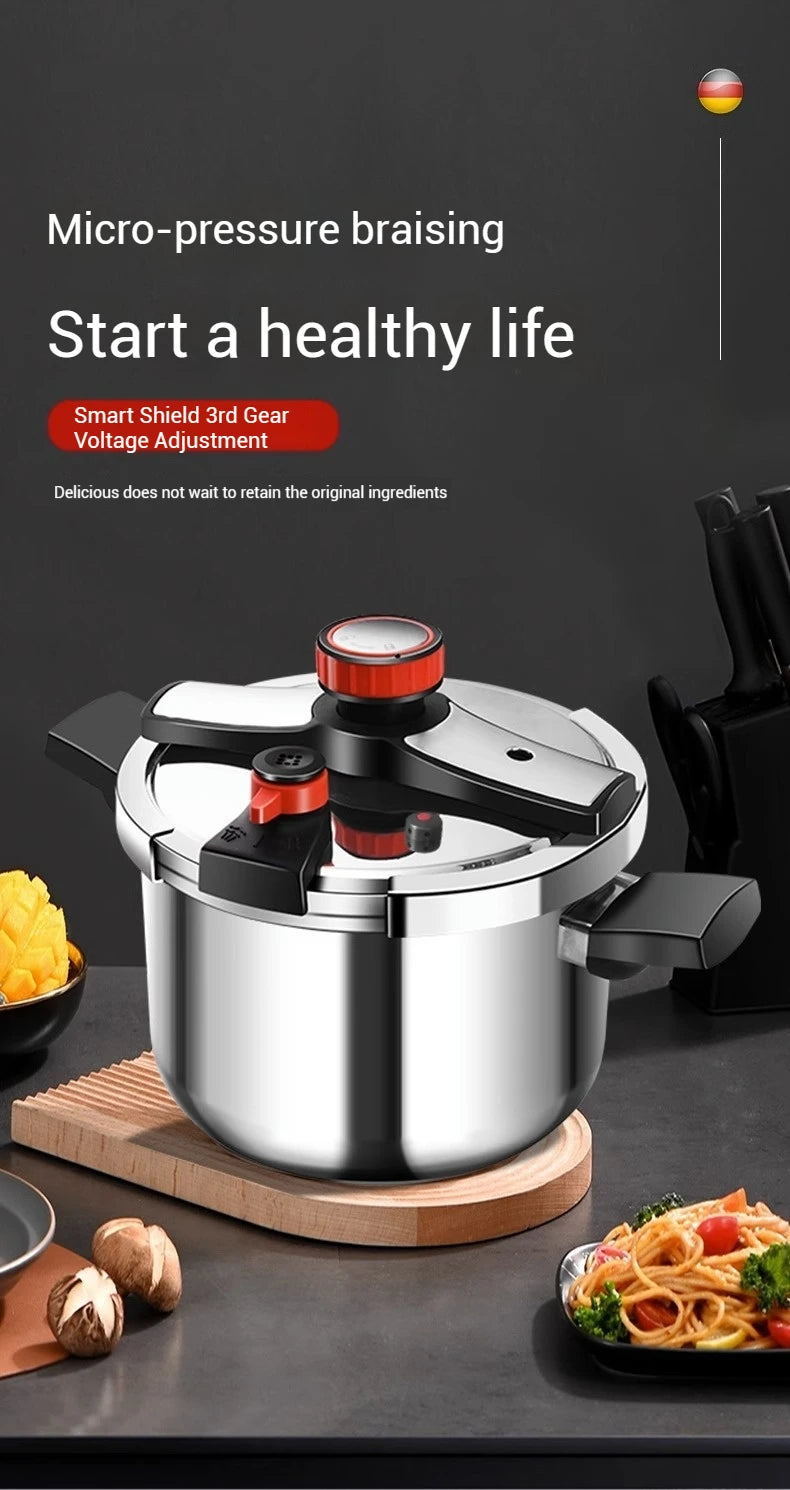 304 stainless steel pressure cooker on wooden base with red pressure cap and side handles