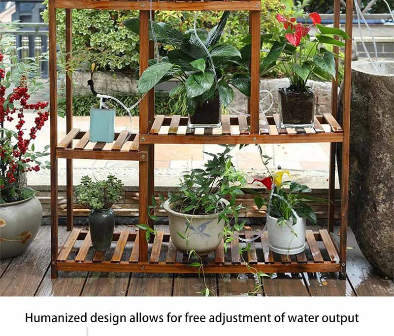 Automatic plant watering bag feeding multiple potted plants on a wooden shelf