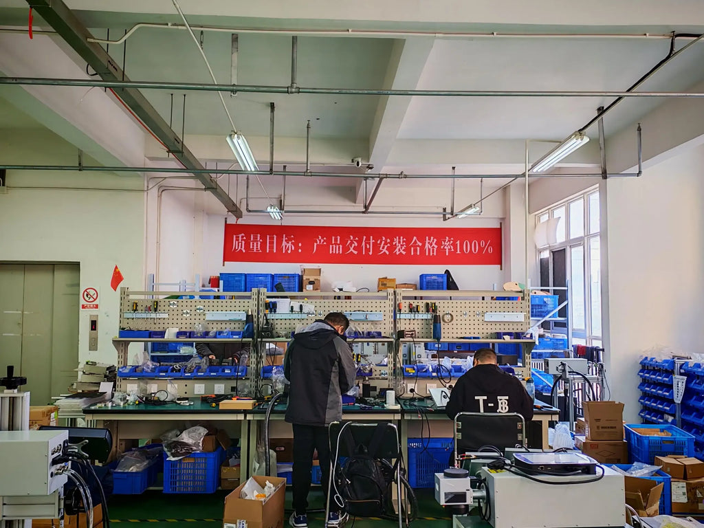 Industrial continuous inkjet printer coding station in a factory workshop