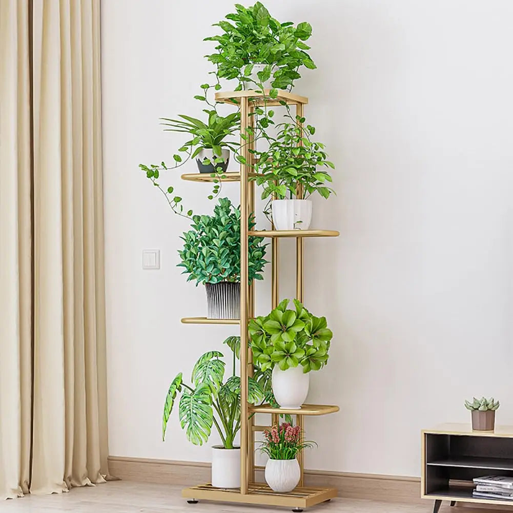 Multi-tier vintage plant display shelf with gold frame, several potted plants on tiers