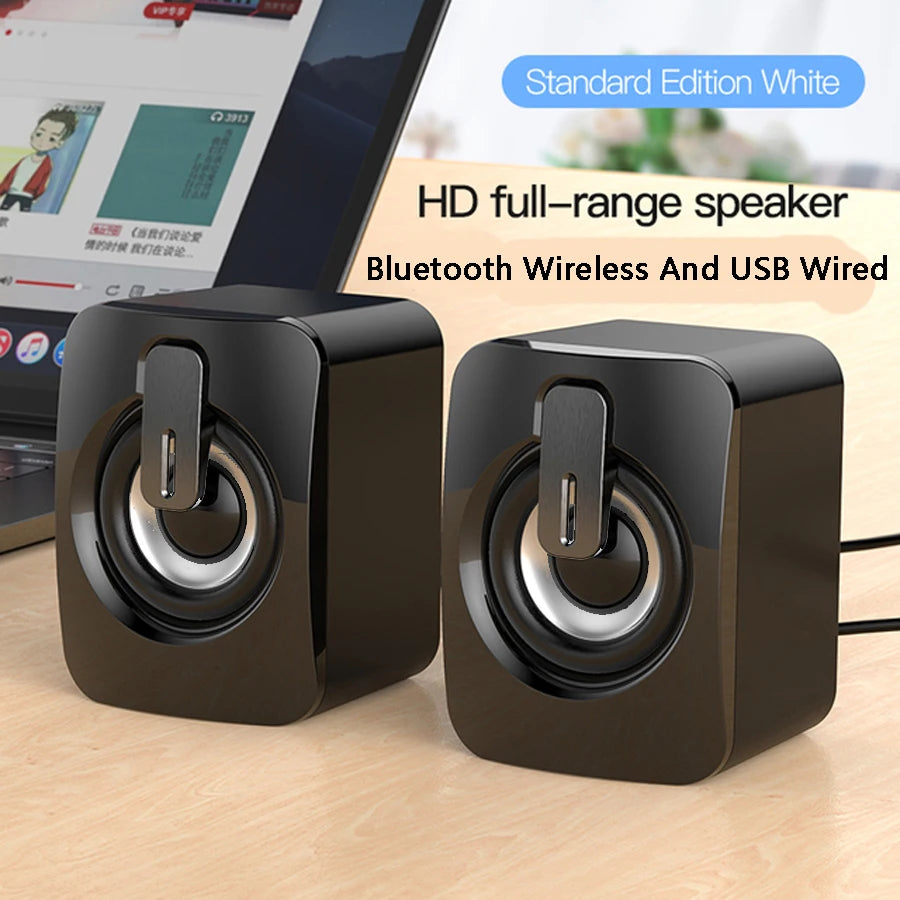 Black mini desktop speaker pair with top USB ports and circular drivers