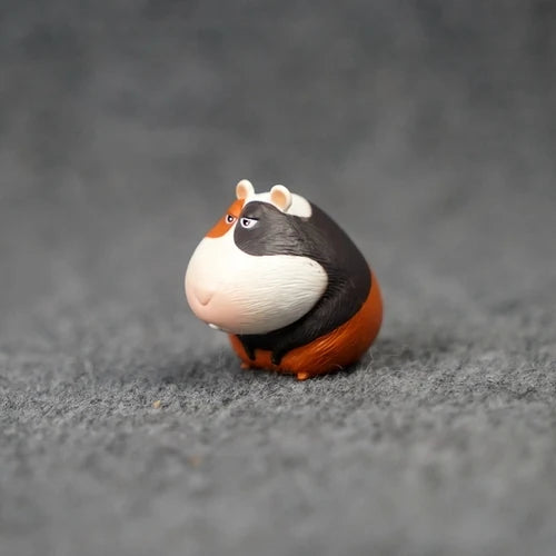 Cute cartoon guinea pig figurine, tri-color miniature PVC model for home decor or unique animal lover gift.