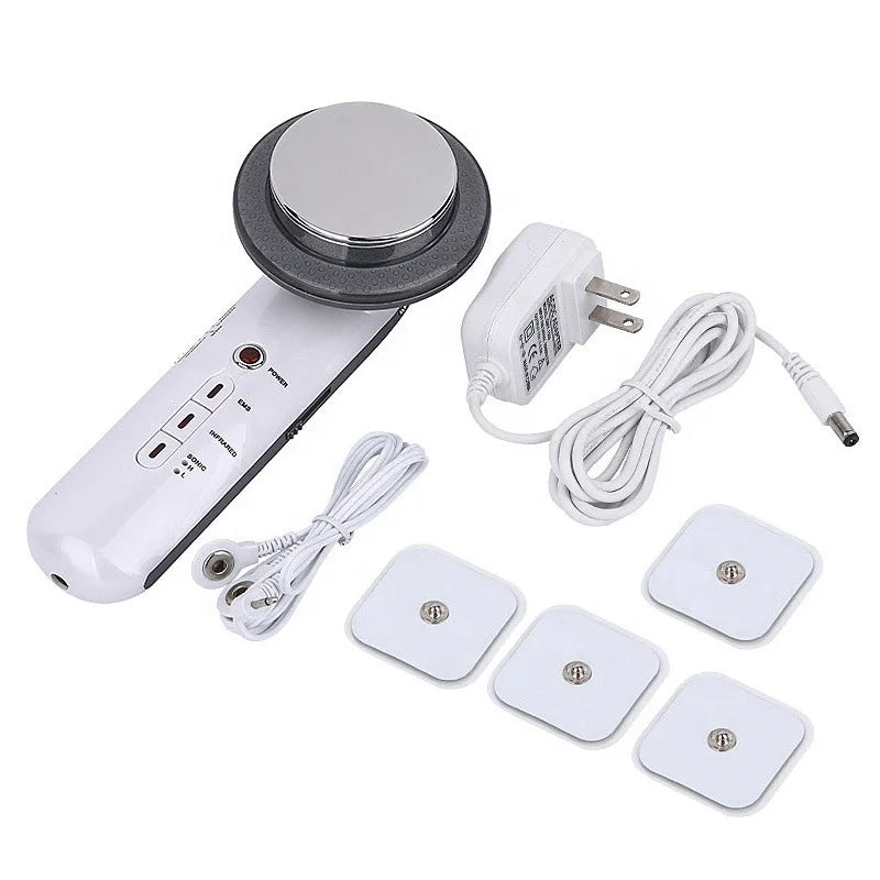 White handheld ultrasound slimming device with metal head, power adapter, EMS cables, and four square electrode pads.