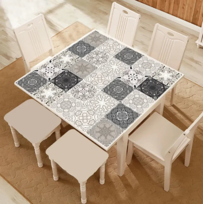 Mosaic tile sticker sheet applied to table surface, gray and white Moroccan squares