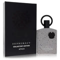 Supremacy Collector's Edition perfume in a speckled grey bottle with a black ring cap and matching black display box.