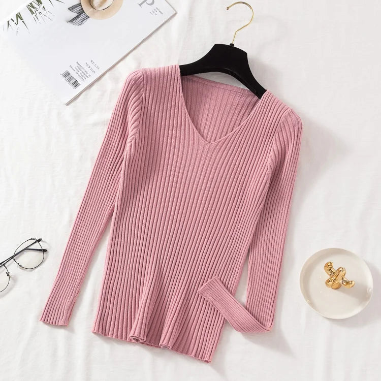 Tidesmit dusty pink long-sleeve sweater in a soft ribbed knit with a classic V-neckline on a hanger.