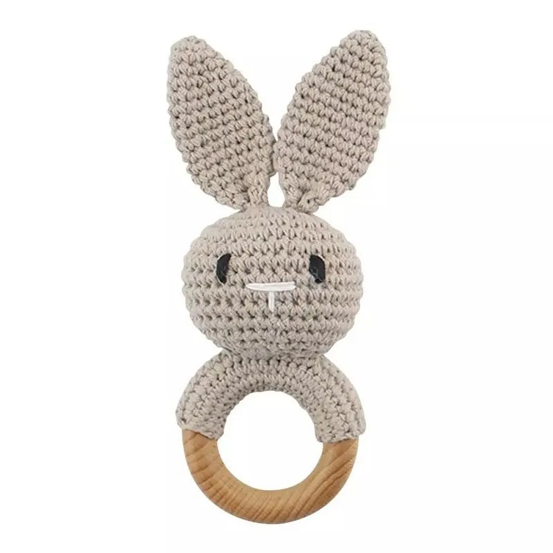 Beige crochet bunny teething ring with natural wood for baby teething relief.