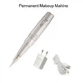 Silver pen-style permanent makeup machine with a needle cartridge, white power adapter, and USB charging cable.
