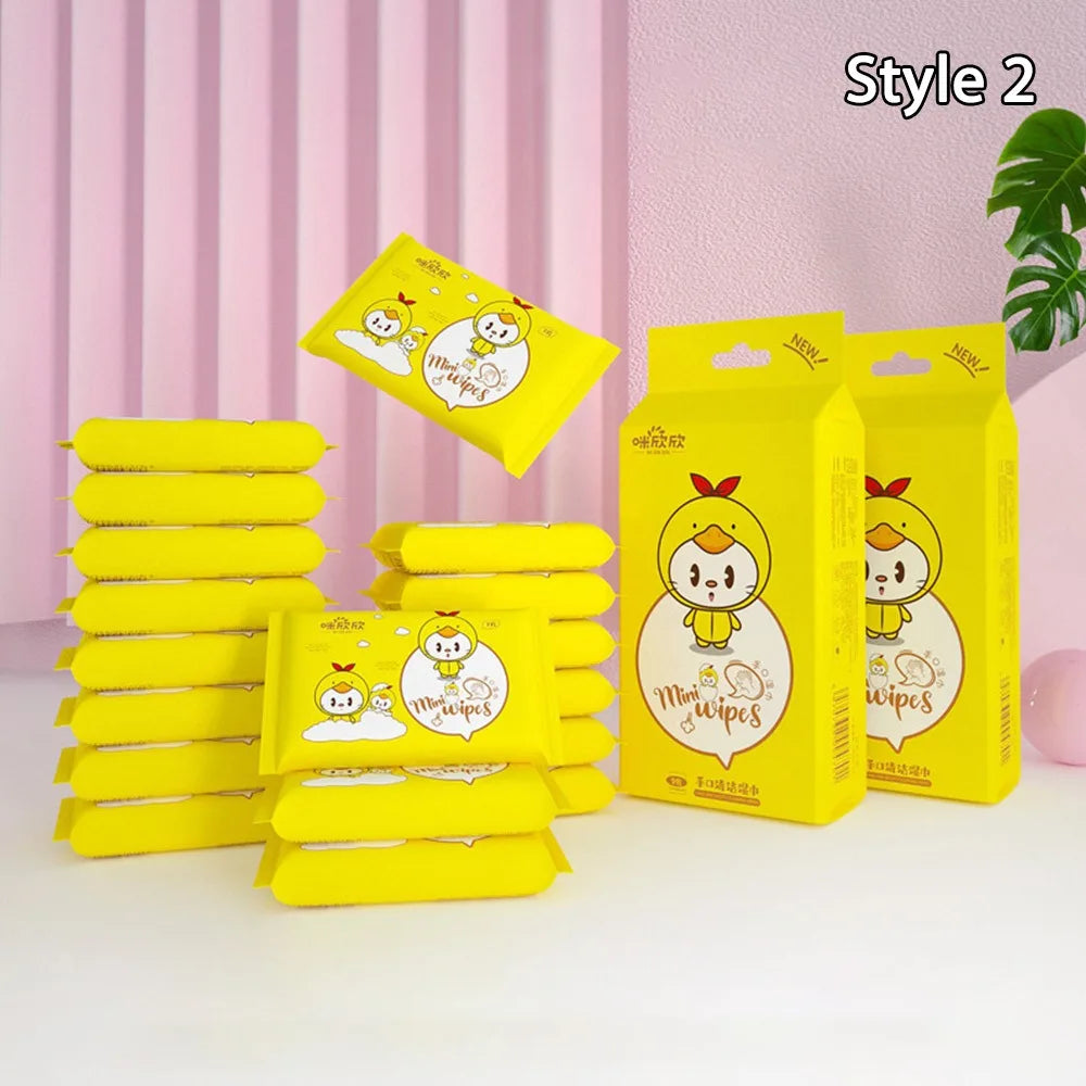 Mini baby care wipes in bright yellow packaging featuring cute cartoon duck characters.