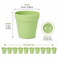 Light green mini round plastic flower pot set of 10 with drainage holes at the bottom.