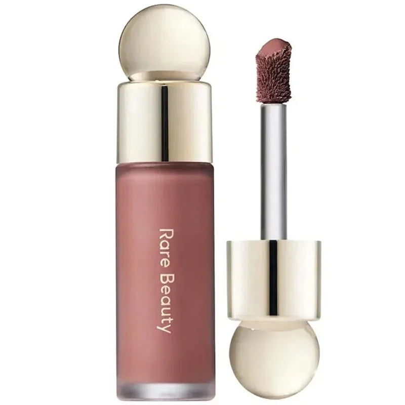 Tidesmit face makeup collection featuring Rare Beauty highlighter and liquid blush shades in texture close-up view