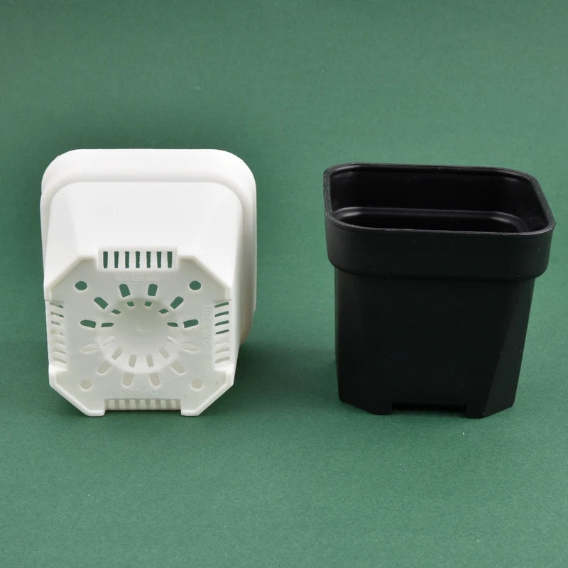 Square planter pots with drainage inserts, one white and one black