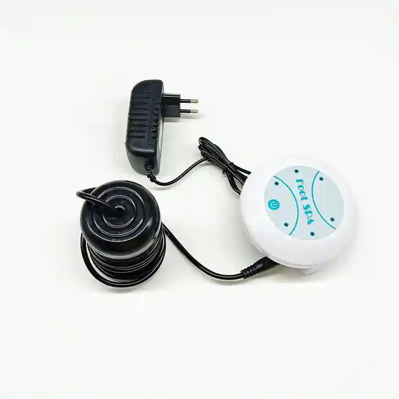 White ionic foot detox spa machine with black ion cleanse array, power adapter, and control unit on white background.